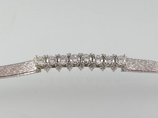 Lot 220. A DIAMOND BRACELET with 26 diamonds claw-set in 18ct white gold.<br>Est $2000-2500
