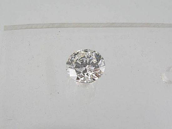Lot 375. A ROUND BRILLIANT CUT DIAMOND; Weight 1.00ct, Colour G, Clarity VS2.<br>Est $4500-5000