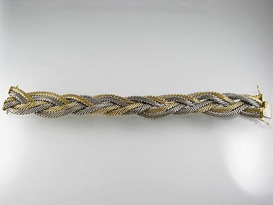 Lot 385. A TWO-COLOUR 18ct GOLD BRACELET, woven design with box clasp.<br>Est $3400-3500
